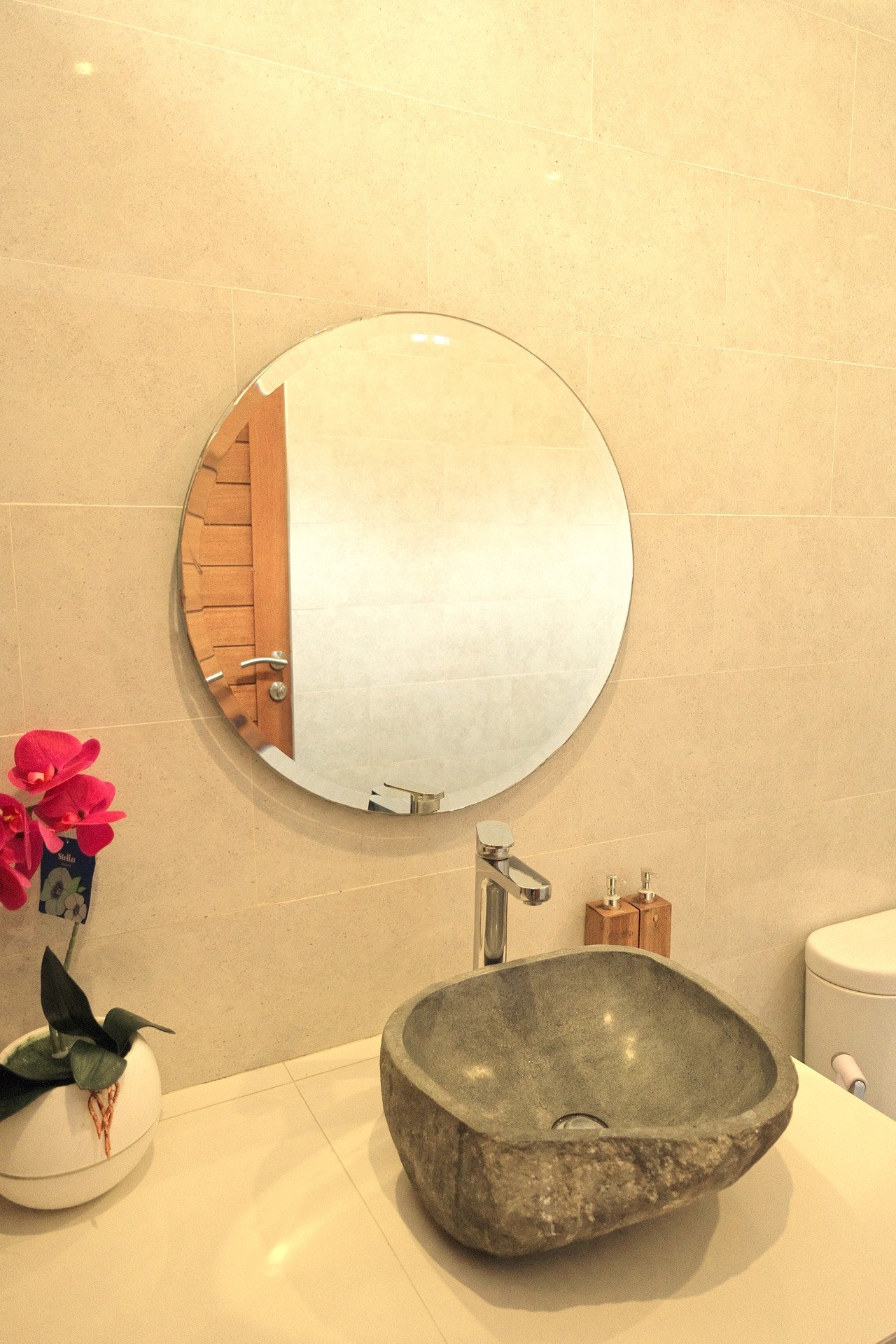 Cahyana House bathroom with a river-stone basin
