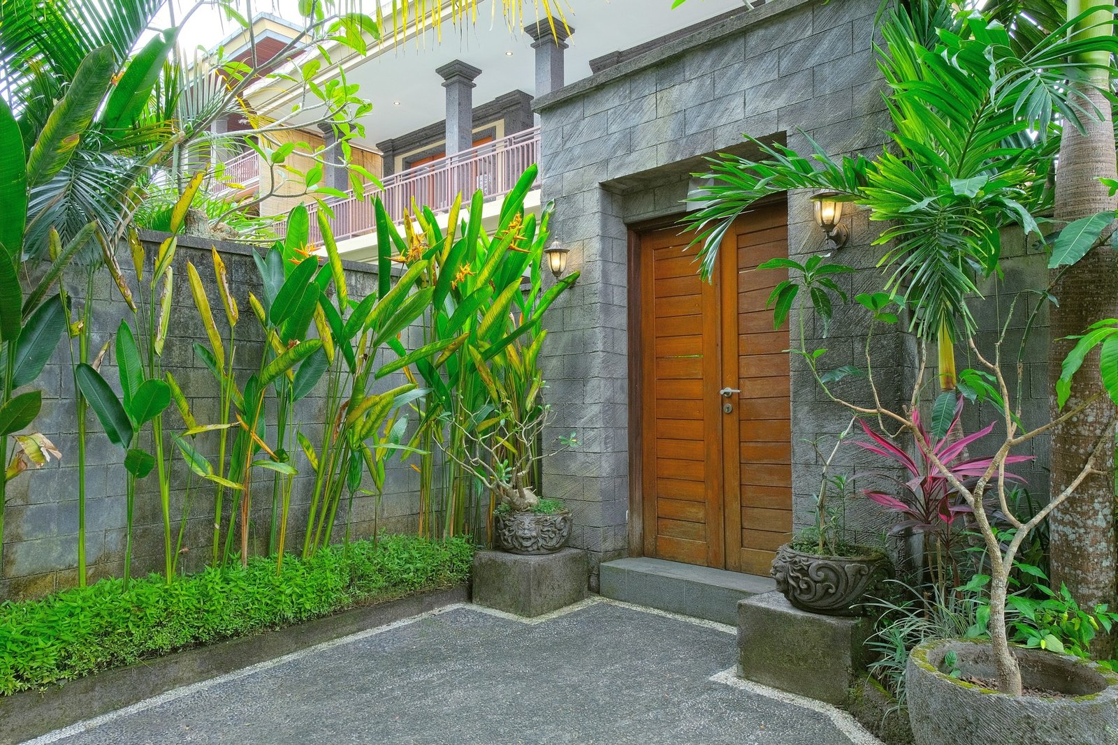 Cahyana House entrance and teak door in the garden