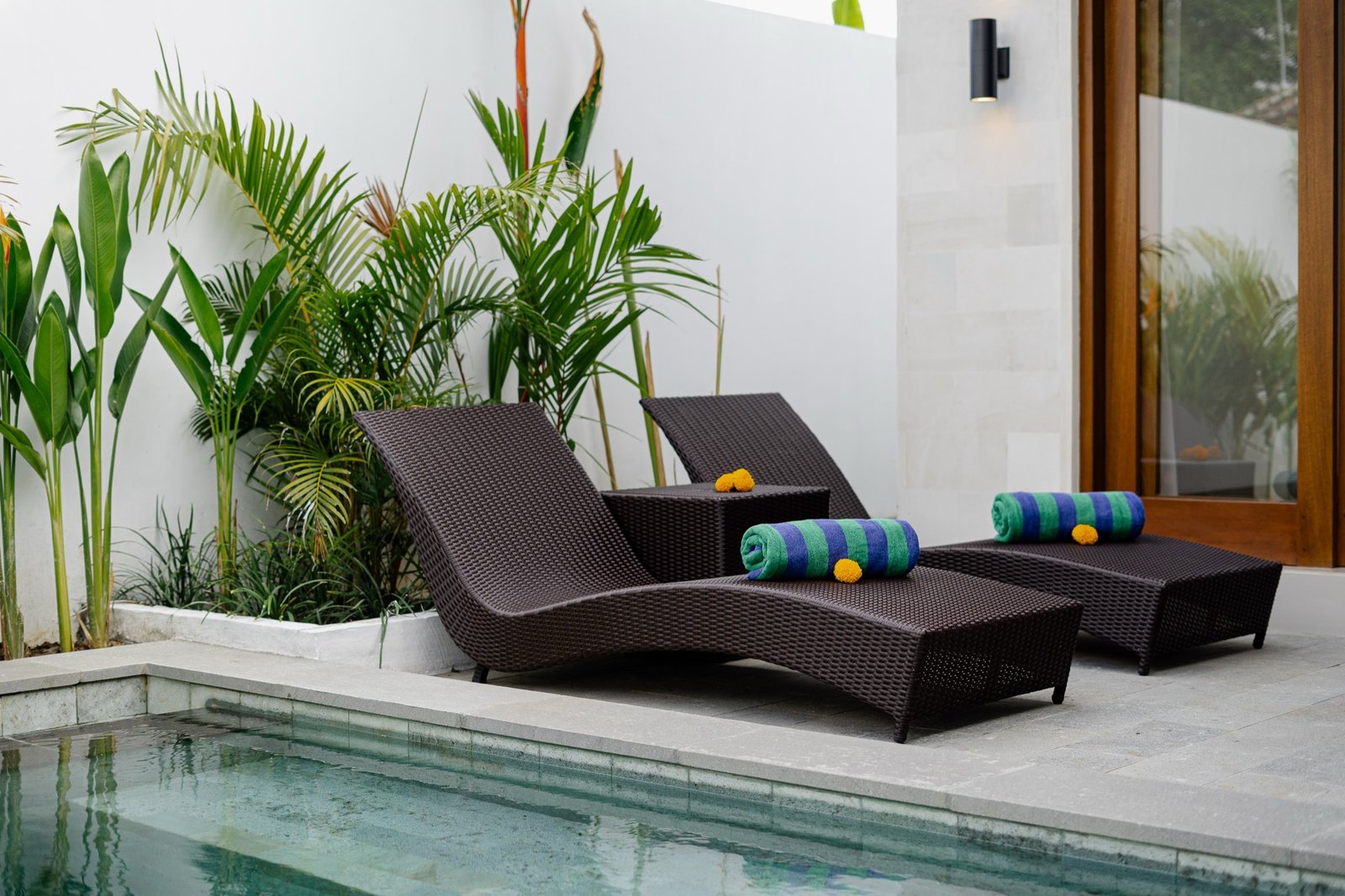 Cahyana Tibuah - a pair of sun loungers by the pool
