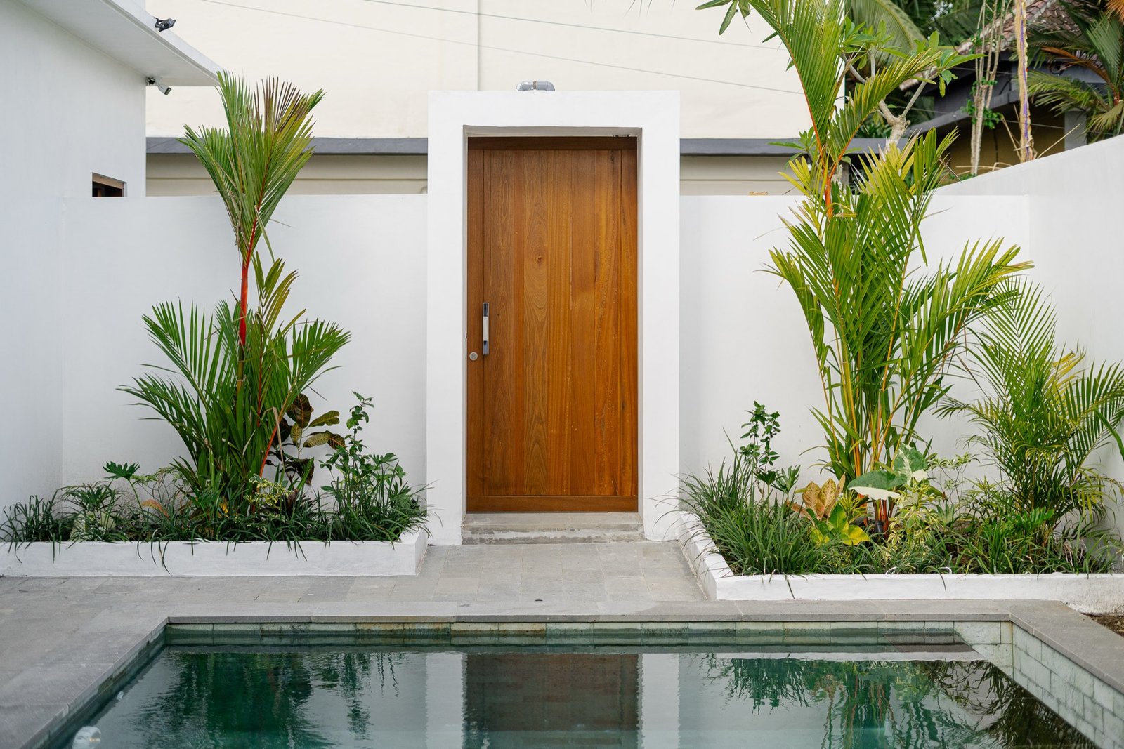 Cahyana Tibuah - the entrance door beside the pool